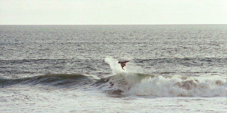 Surfer in Echo Beach, Canggu shot from La Brisa Bali